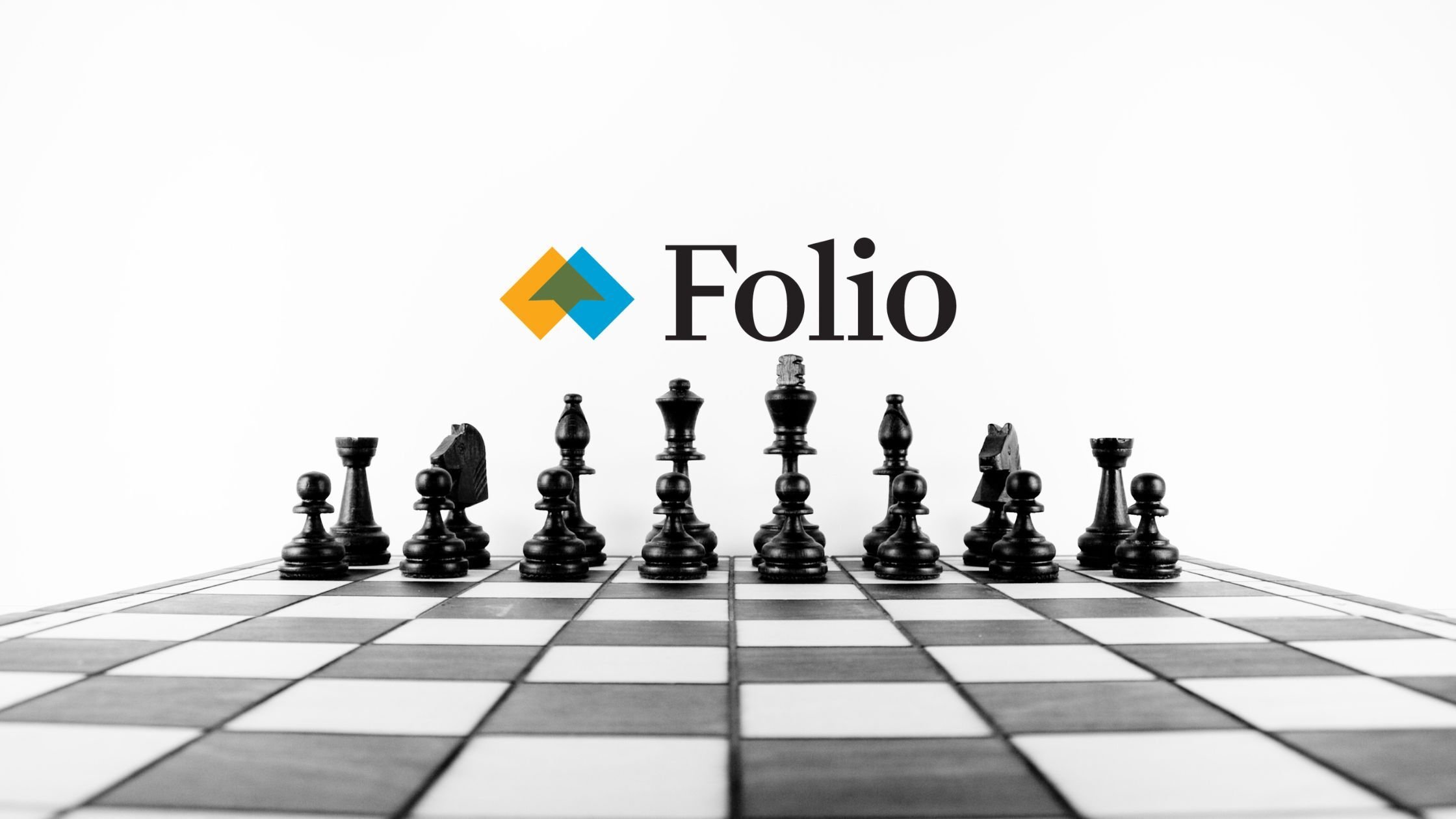 Black and white photo of chess pieces on a board with Folio logo